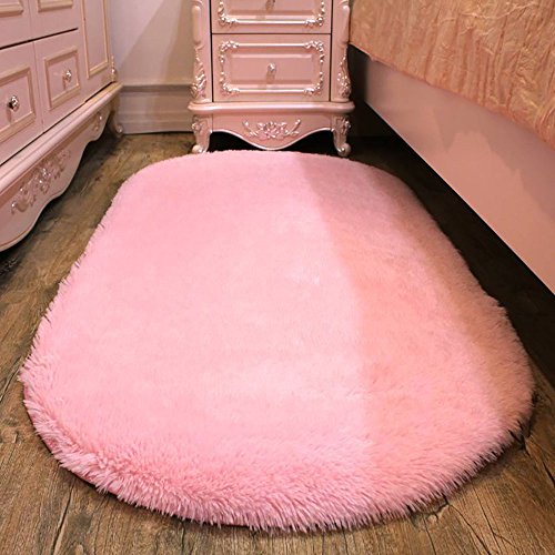 Alfombra ovalada rosa para la habitación de una chica