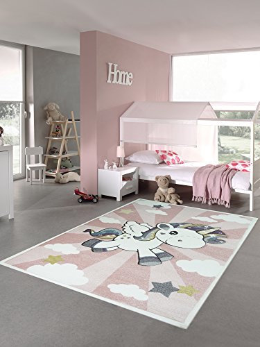 Gran alfombra rosa con un unicornio en polipropileno de diferentes tamaños incluyendo XXL 200 x 290 cm