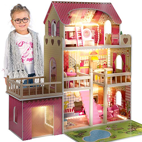 Una gran casa de muñecas de madera con luces LED de Kinderplay en un estilo femenino y romántico.